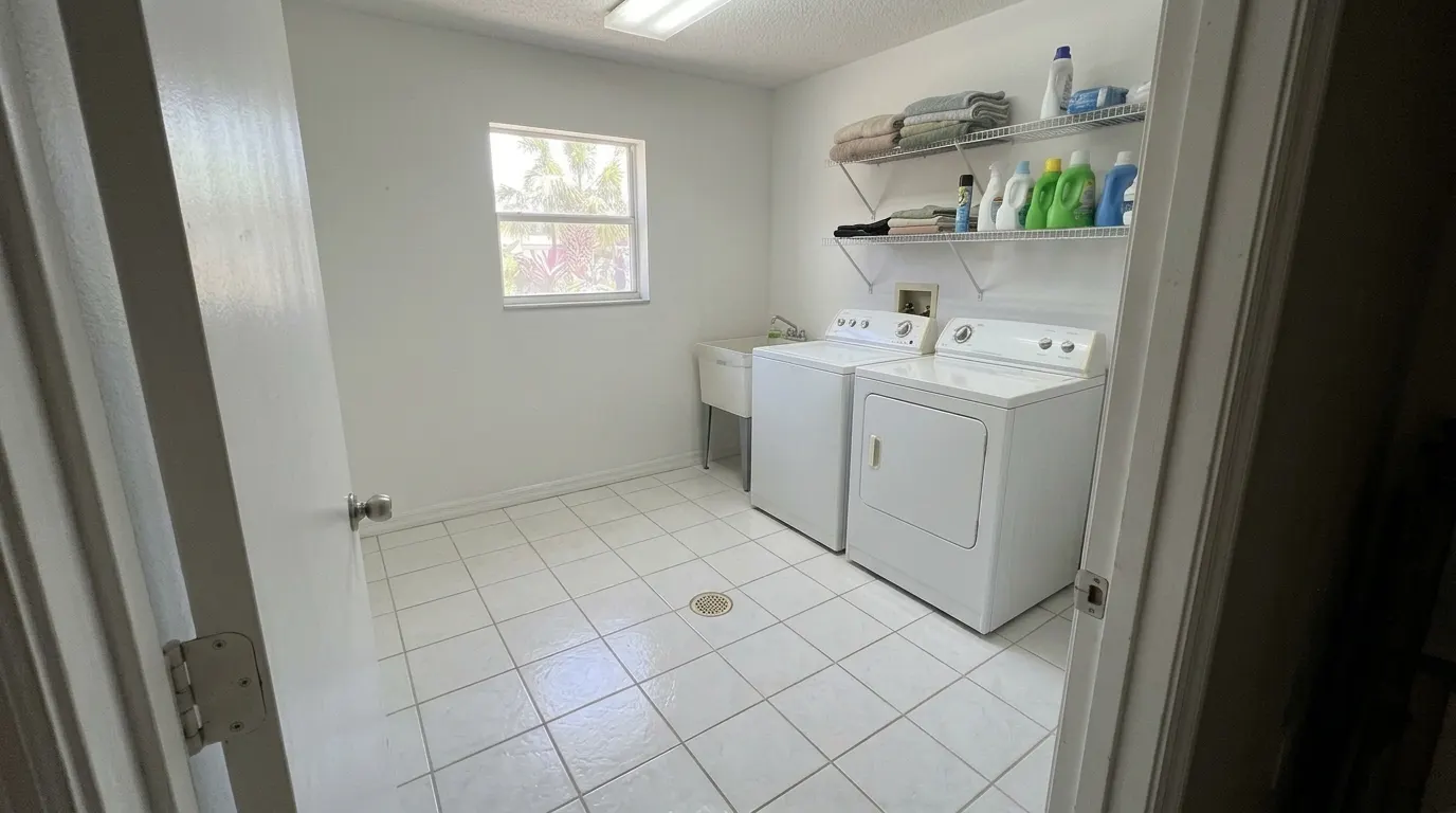Same laundry room sanitized, dry and spotless after cleanup